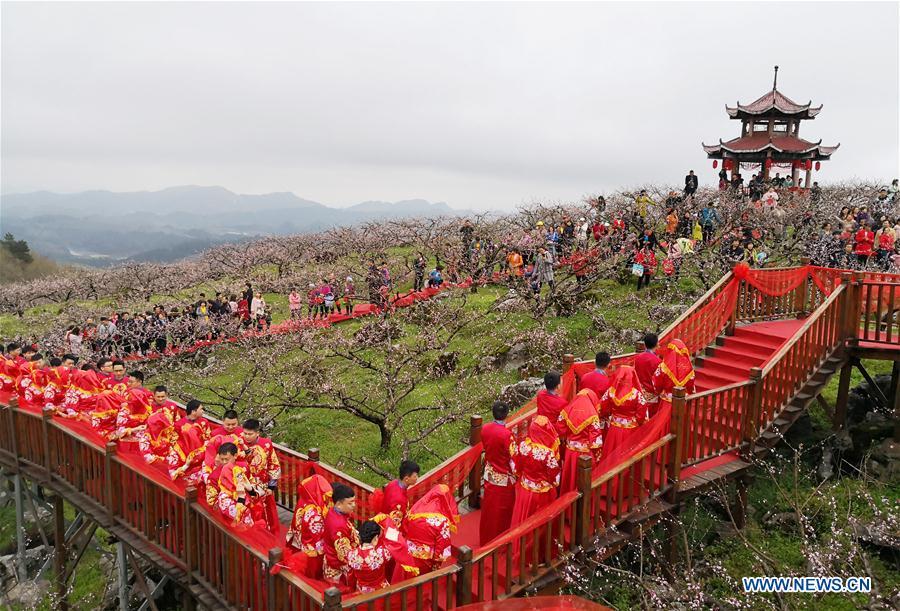 <?php echo strip_tags(addslashes(Couples attend a group wedding ceremony in traditional style in Wude Town of Shiqian County, southwest China's Guizhou Province, April 4, 2019. A group wedding ceremony in traditional style was held here Thursday for couples who have been striving on the frontline for the county's fight against poverty. (Xinhua/Yang Wenbin))) ?>