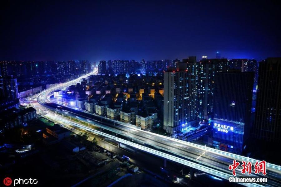 A light show on a newly-opened bridge on Nongye Road in Zhengzhou City, Henan Province. The bridge was illuminated in six colours to create amazing visual effects. (Photo/IC).