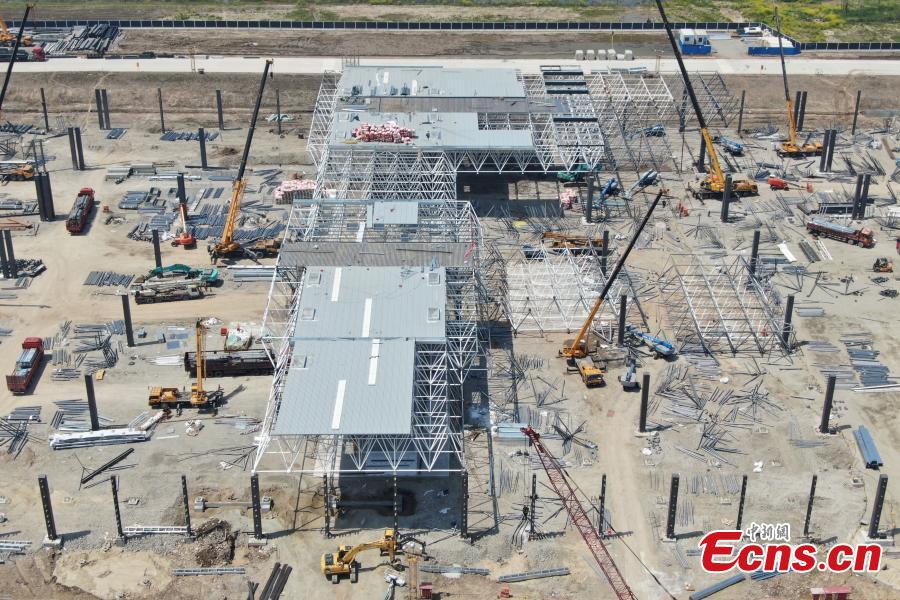 <?php echo strip_tags(addslashes(Construction of Tesla's Shanghai Gigafactory 3 is in full swing, April 8, 2019. Several sets of steel structural roof frames have been installed. The new plant, Tesla's first outside the United States, is located in Lingang Area, a high-end manufacturing park in the southeast harbor of Shanghai. It is designed to have an annual capacity to create 500,000 electric cars. (Photo: China News Service/Zhang Hengwei))) ?>
