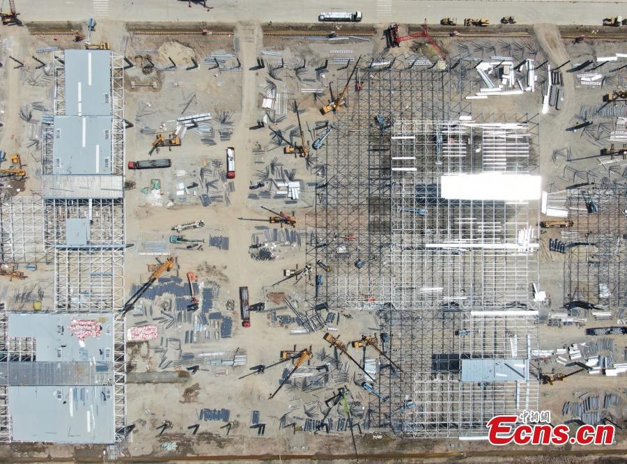 <?php echo strip_tags(addslashes(Construction of Tesla's Shanghai Gigafactory 3 is in full swing, April 8, 2019. Several sets of steel structural roof frames have been installed. The new plant, Tesla's first outside the United States, is located in Lingang Area, a high-end manufacturing park in the southeast harbor of Shanghai. It is designed to have an annual capacity to create 500,000 electric cars. (Photo: China News Service/Zhang Hengwei))) ?>