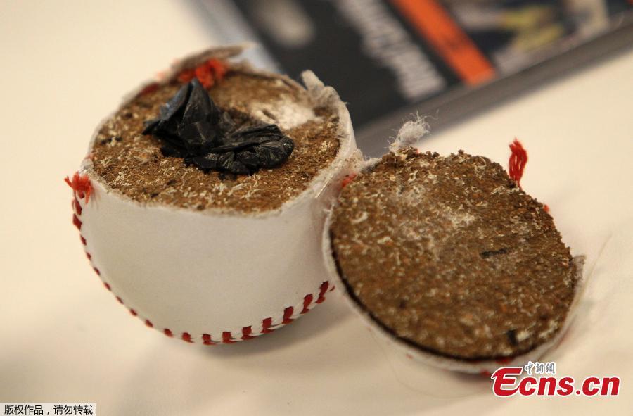 <?php echo strip_tags(addslashes(Confiscated drugs hidden inside a baseball are pictured during the annual media conference of the main customs office at the airport in Frankfurt am Main, western Germany, on April 8, 2019.  (Photo/Agencies))) ?>