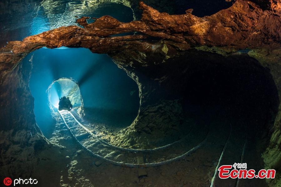 <?php echo strip_tags(addslashes(Photographer Martin Strmiska dived the Slovak Opal Mines, which has many tunnels, shafts and adits excavated in the volcanic hills. Five lowest levels are flooded, offering an incredible experience when diving in completely crystal clear water.(Photo/IC))) ?>