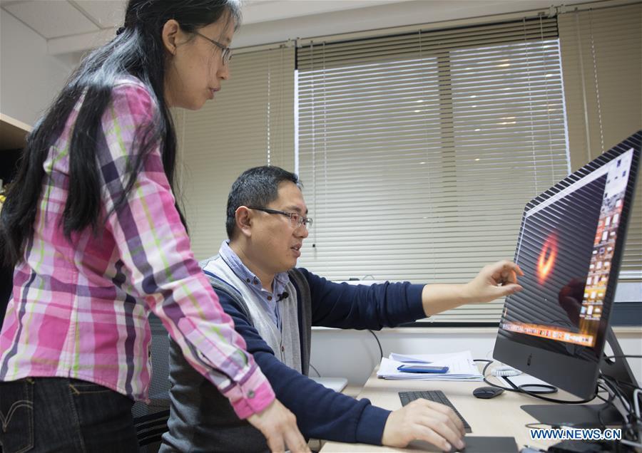 <?php echo strip_tags(addslashes(Chinese researchers Lu Rusen (R) and Huang Lei discuss the imaging methods of the image of a black hole in Shanghai Astronomical Observatory (SAO), in east China's Shanghai, April 9, 2019. The image of the black hole, based on observations through the Event Horizon Telescope (EHT), a planet-scale array of eight ground-based radio telescopes forged through international collaboration, was unveiled in coordinated press conferences across the globe at around 9:00 p.m. (Beijing time) on Wednesday. The landmark result offers scientists a new way to study the most extreme objects in the universe predicted by Albert Einstein's general relativity. (Xinhua/Jin Liwang))) ?>