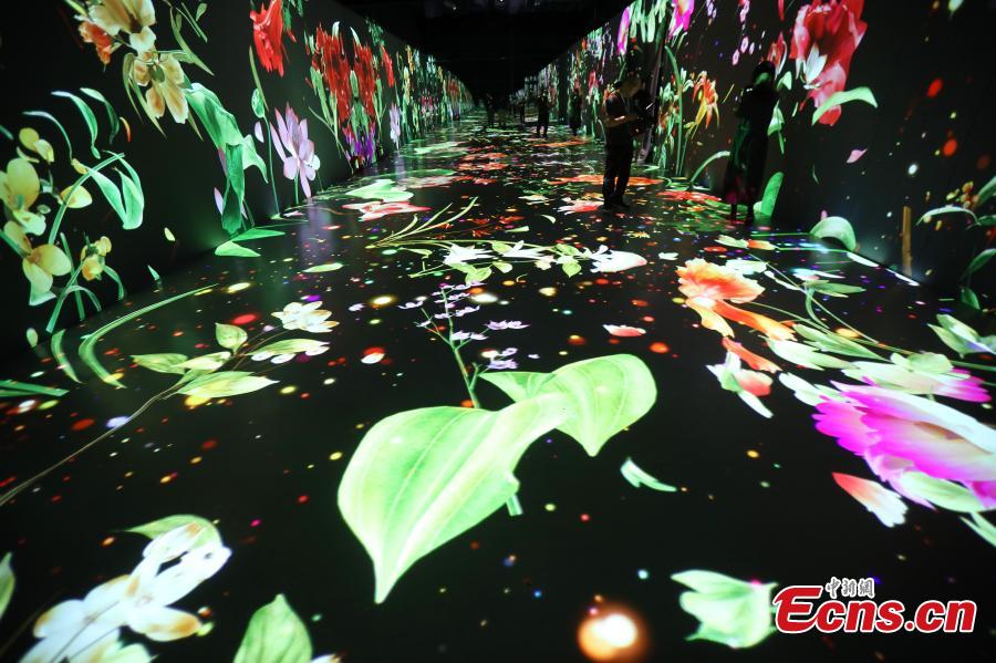 An interactive art installation project that draws inspiration from three famous paintings in Chinese history opens at a gallery in Deji Plaza, an upscale office and shopping mall complex in Nanjing, Jiangsu Province, April 11, 2019. Visitors appear to immerse themselves into scenes in the paintings. The three scrolls included \