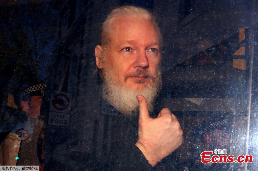 WikiLeaks founder Julian Assange arrives at the Westminster Magistrates Court, after he was arrested in London, Britain, April 11, 2019. British police dragged WikiLeaks founder Julian Assange out of Ecuador\'s embassy on Thursday after his seven-year asylum was revoked, paving the way for his extradition to the United States for one of the biggest ever leaks of classified information. (Photo/Agencies)