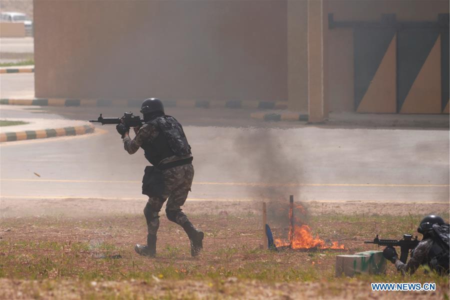 <?php echo strip_tags(addslashes(Soldiers of the Jordan Armed Forces (JAF) perform an anti-terror drill on the opening ceremony of the 11th annual Warrior Competition at the King Abdullah II Special Operations Training Center (KASOTC) in Amman, Jordan, April 14, 2019. (Xinhua/Lin Xiaowei))) ?>