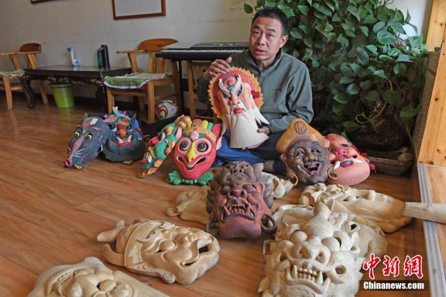 <?php echo strip_tags(addslashes(Ma Lande shows masks of the Nuo Opera at his studio in Lanzhou City, Northwest China's Gansu Province, April 14, 2019. The handicraftsman said he has made more than 2,000 Nuo Opera masks in the past 17 years, depicting a broad range of topics, including mythical figures from Chinese legends and classic novels. Masks, usually carved out of willow or camphor wood, are an important part of Nuo Opera, an ancient folk drama still popular in some parts of China. The purpose of Nuo Opera is to drive away devils, disease and evil influences, and also to petition the gods for their blessings. (Photo: China News Service/Yang Yanmin))) ?>