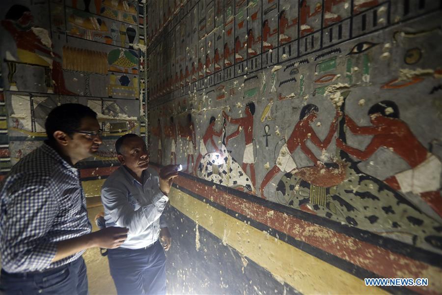 People visit a tomb in Saqqara, Egypt on April 13, 2019. Egyptian Ministry of Antiquities opened on Saturday a tomb of a Fifth Dynasty dignitary which was discovered recently at Saqqara Necropolis near the Giza pyramids. Minister of Antiquities Khaled al-Anany, along with 52 ambassadors and cultural attaches of foreign, Arab and African countries, toured Saqqara Necropolis to inspect the tomb of Khuwy, who lived at the end of the Fifth Dynasty of the Old Kingdom. The Old Kingdom of Egypt is the period spanning 2686 BC to 2181 BC, which is also known as the Age of the Pyramids. (Xinhua/Ahmed Gomaa)