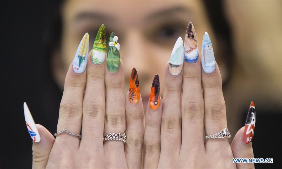 <?php echo strip_tags(addslashes(A model displays her nail fashion during the Nail Art Challenge at the 2019 Revel in Beauty event in Toronto, Canada, on April 15, 2019. The Nail Art Challenge was held on Monday to showcase the creative process of nail art to spectators. (Xinhua/Zou Zheng))) ?>