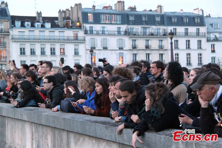 <?php echo strip_tags(addslashes(People look at the fire on the Notre Dame Cathedral in central Paris, capital of France, on April 15, 2019. A blaze broke out on Monday afternoon at the Notre Dame Cathedral in central Paris.  (Photo/China News Service))) ?>