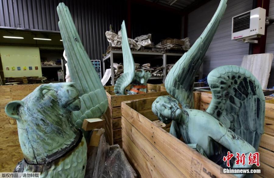 Photo taken in Marsac-sur-Isle near Bordeaux, on April 16, 2019 shows statues which sat around the spire of the Notre-Dame cathedral in Paris, stored in SOCRA workshop before restoration. (Photo/Agencies)