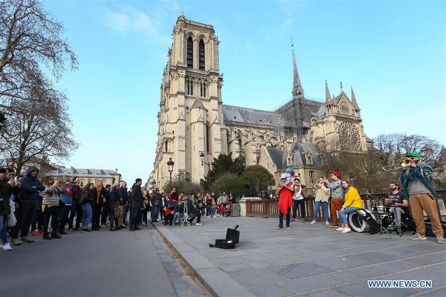 File photo taken on March 23, 2019 shows the exterior of the Notre Dame Cathedral in Paris, France. The devastating fire at Notre Dame Cathedral in central Paris has been put out after burning for 15 hours, local media reported on April 16, 2019. In early evening on April 15, a fire broke out in the famed cathedral. Online footage showed thick smoke billowing from the top of the cathedral and huge flames between its two bell towers engulfing the spire and the entire roof which both collapsed later. Notre Dame is considered one of the finest examples of French Gothic architecture which receives about 12 million visitors every year. (Xinhua/Zhang Cheng)