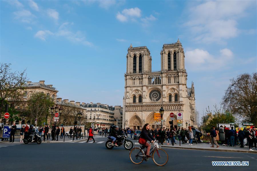 File photo taken on March 23, 2019 shows the exterior of the Notre Dame Cathedral in Paris, France. The devastating fire at Notre Dame Cathedral in central Paris has been put out after burning for 15 hours, local media reported on April 16, 2019. In early evening on April 15, a fire broke out in the famed cathedral. Online footage showed thick smoke billowing from the top of the cathedral and huge flames between its two bell towers engulfing the spire and the entire roof which both collapsed later. Notre Dame is considered one of the finest examples of French Gothic architecture which receives about 12 million visitors every year. (Xinhua/Zhang Cheng)