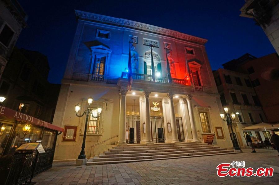 The fa?ade of the La Fenice Opera House in Venice, Italy is lit up with the colors of the French flag on Tuesday, April 16, 2019 in solidarity with the people of France following the fire at the Notre Dame Cathedral. (Photo/IC)