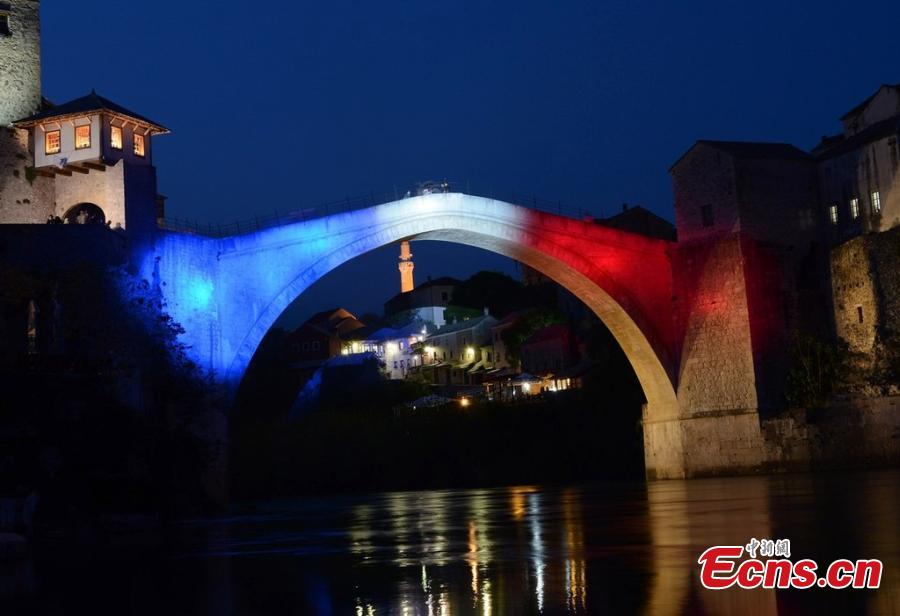 Photo taken late on the evening of Tuesday, April 16, 2019 shows Bosnia and Herzegovina\'s Stari Most in the southern city of Mostar illuminated with the colors of the French flag out of respect for the people of France after a fire nearly destroyed the Notre Dame Cathedral in Paris. Stari Most is one of most recognizable icons of Ottoman architecture. In 1993, it was completely destroyed by artillery fire, some 427 years after it was built. It was rebuilt in 2004.  (Photo/IC)