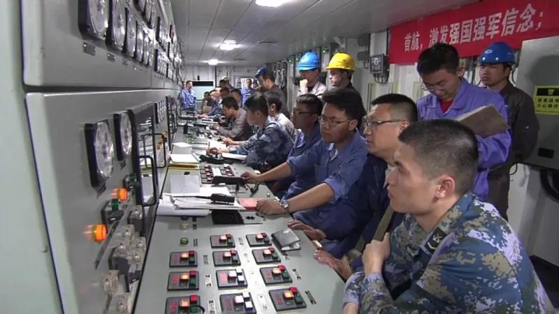 Navy soldiers work on China\'s first domestically made aircraft carrier. (Photo/CCTV)