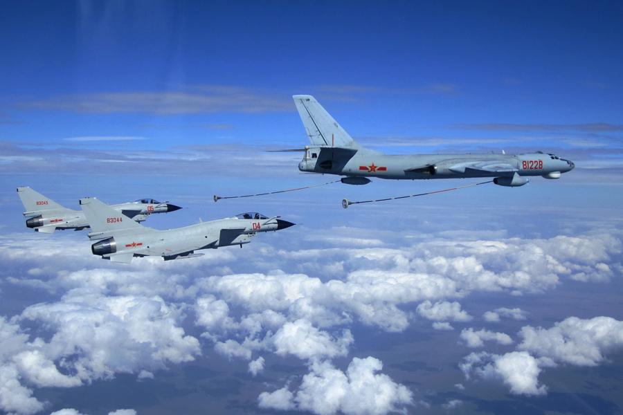 <?php echo strip_tags(addslashes(Two fighter jets from the PLA Navy prepare for aerial refueling from a tanker aircraft on July 28, 2014. (WU CHUANJUN/FOR CHINA DAILY))) ?>