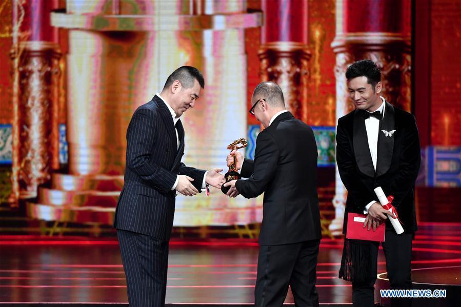 Chen Jianbin (L), winner of the Tiantan Award for Best Screenplay for movie \