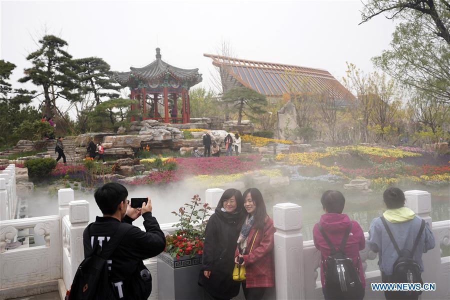 Visitors tour the Beijing Garden of the 2019 Beijing International Horticultural Exhibition (Expo 2019 Beijing) during a trial run in Yanqing District of Beijing, capital of China, April 20, 2019. Beijing on Saturday held a trial opening of the site for the upcoming 2019 Beijing International Horticultural Exhibition to test the reception capacity of the event. About 60,000 people visited the 503-hectare expo site Saturday. (Xinhua/Ju Huanzong)