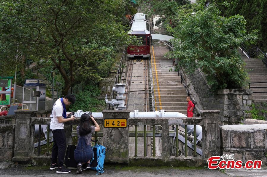 A view of Hong Kong\'s Peak Tram, one of the world\'s oldest and most famous funicular railways, April 22, 2019. A project to upgrade the tram will involve a significant investment of HK$684 million, replacing the current tram cars, which have a capacity of 120 passengers, with new 210-passenger tram cars. The first suspension of the Peak Tram service will begin on April 23 and last approximately two to three months. (Photo: China News Service/Zhang Wei)
