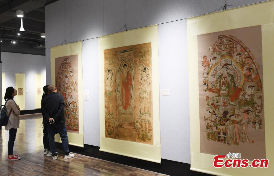 An exhibition featuring over 90 replicas of relics from Mogao Grottoes is underway at Northwest Normal University in Lanzhou City, Northwest China\'s Gansu Province, April 23, 2019. The life-size replicas are based on original murals or paintings from Mogao Grottoes, which are now collected in museums in the UK, France, the U.S., and Japan.  (Photo: China News Service/Yang Yanmin)