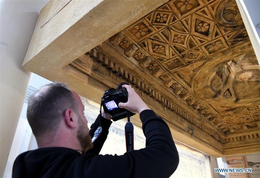 A man takes photos of the 3D-printed ceiling of the Bel Temple in the Damascus National Museum in Damascus, Syria, on April 23, 2019. A 3D-printed ceiling of a worship area of the Bel Temple of Palmyra was showcased in the Damascus National Museum on Tuesday. Italian artists replicated the part of the ceiling that was produced as a gift to the national museum. The original part of the ceiling was destroyed along with the entire Bel Temple by the Islamic State (IS) group during its invasion of the ancient oasis city of Palmyra in 2014. (Xinhua/Ammar Safarjalani)