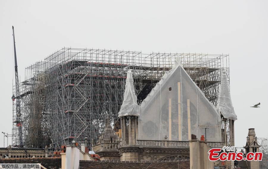 Protective material has been wrapped around parts of Notre Dame, April 23, 2019. Architects working on preserving Notre-Dame are rushing to cover the cathedral before rain can cause further damage. (Photo/Agencies)