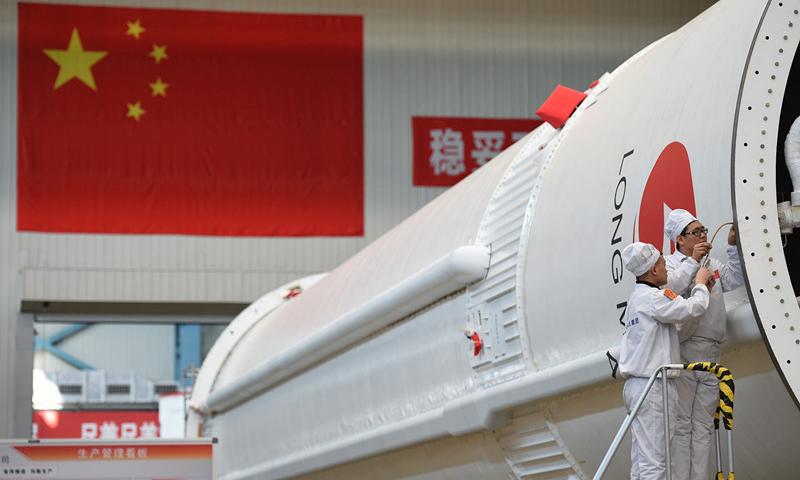 <?php echo strip_tags(addslashes(People work in the assembly and test workshop for China's Long March-5 rocket in the new generation launch vehicle industrialization base in Tianjin. April 24 is China's Space Day. China plans to launch the third of its large carrier rocket Long March-5 in July. The second Long March-5 rocket was launched from the Wenchang Space Launch Center in the southern province of Hainan on July 2, 2017, but a malfunction occurred less than six minutes after lift-off. (Photo provided by China Aerospace Science and Technology Corp.))) ?>