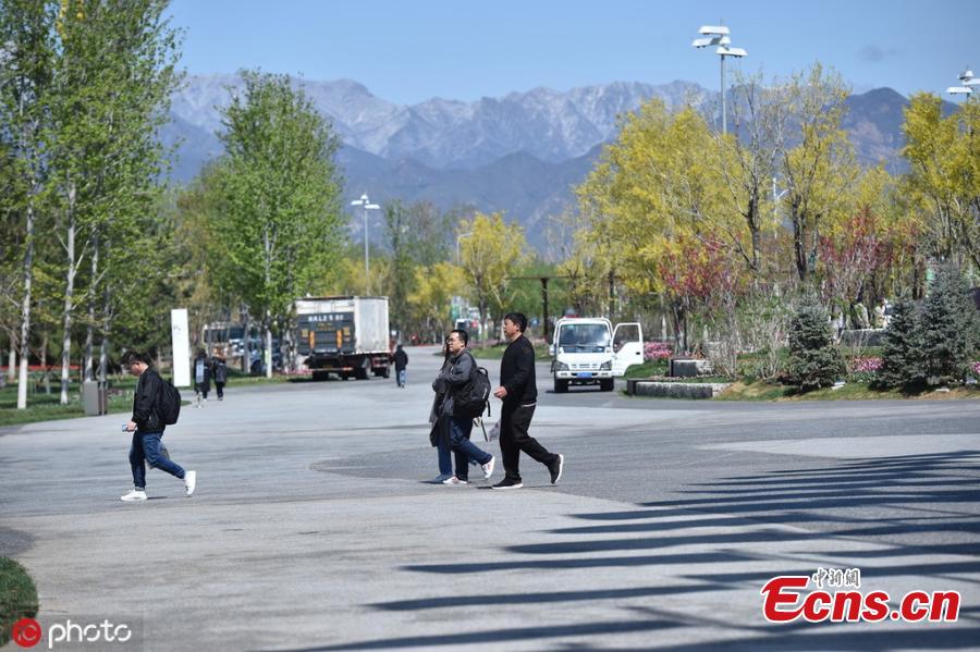 A view of the venue for the Beijing International Horticultural Exhibition against the backdrop of snow-capped mountains in Yanqing district, on the northern outskirts of Beijing, April 25, 2019. All the preparation work, including construction of the site and exhibits, has been completed as the April 29 official opening of the expo draws near, according to the organizer. (Photo/IC)