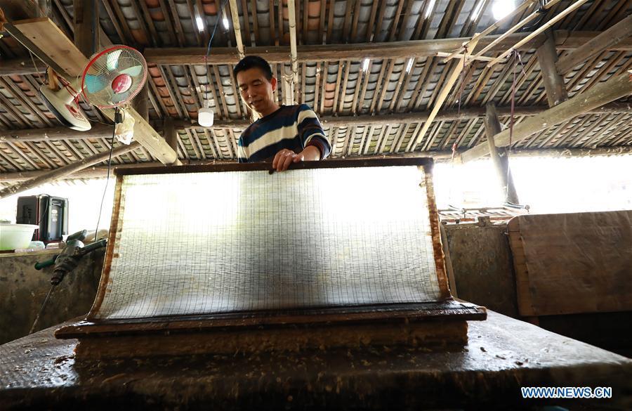 <?php echo strip_tags(addslashes(Wang Xingwu makes paper at a workshop in Shiqiao Village of Danzhai County, southwest China's Guizhou Province, April 24, 2019. Wang Xingwu, 53, a national intangible cultural heritage inheritor in papermaking, learned the papermaking technique from his family as a child. Besides exerting the old papermaking technique to its full potential, Wang keeps raising product quality and improving the making procedure. With the involvement of plants in the papermaking process, he has created more than 160 kinds of patterned papers and paper crafts. He also develops a kind of handmade white paper more suitable for writing calligraphy and painting. (Xinhua/Huang Xiaohai))) ?>