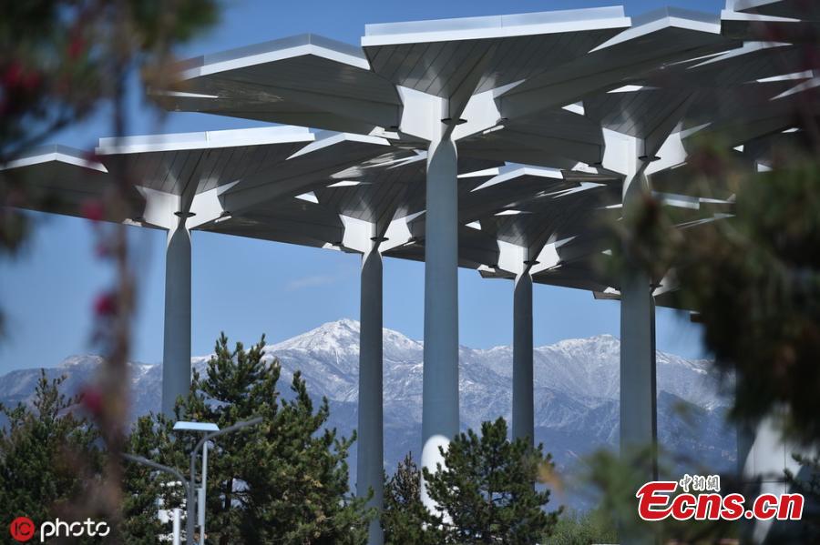 A view of the venue for the Beijing International Horticultural Exhibition against the backdrop of snow-capped mountains in Yanqing district, on the northern outskirts of Beijing, April 25, 2019. All the preparation work, including construction of the site and exhibits, has been completed as the April 29 official opening of the expo draws near, according to the organizer. (Photo/IC)