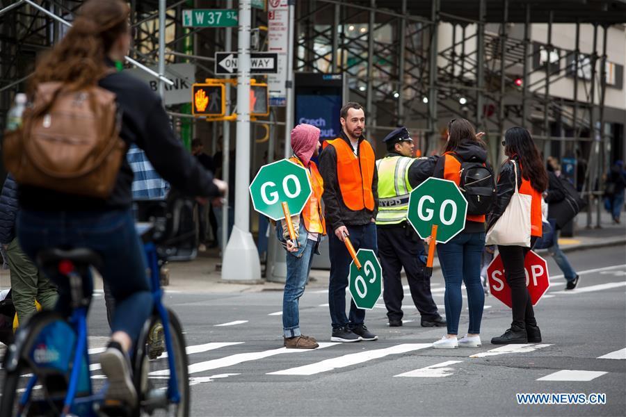 People walk on Broadway during the Car Free Earth Day 2019 in New York, the United States, April 27, 2019. The annual event was created to help raise awareness about environmentally friendly ways to get around town. (Xinhua/Michael Nagle)