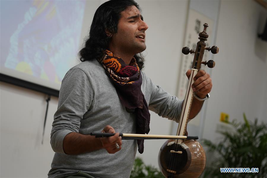 <?php echo strip_tags(addslashes(Majid Doulatshah plays Iranian musical instrument in Nanjing, capital of east China's Jiangsu Province, April 28, 2019. A cultural exchange event between young representatives from Nanjing and foreign students from Nanjing University of the Arts was held in Nanjing. (Xinhua/Ji Chunpeng))) ?>
