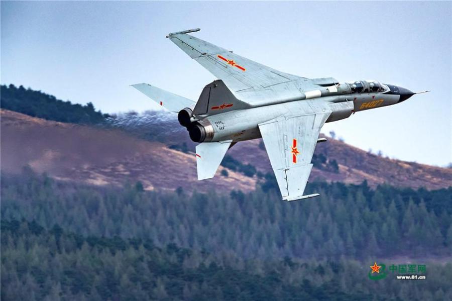 A PLA Air Force warplane in an ultra-low altitude flight training in a valley, April 25, 2019. (Photo/81.cn)