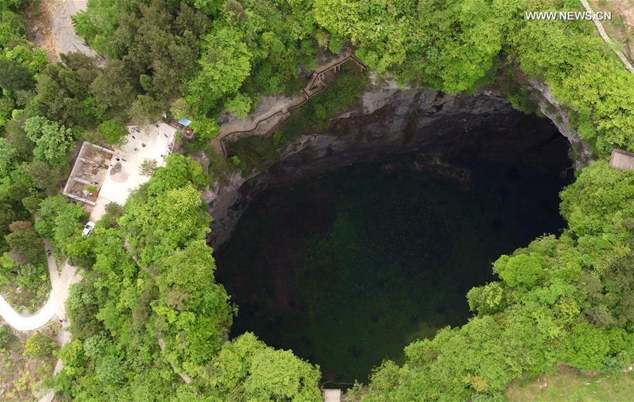 <?php echo strip_tags(addslashes(Aerial photo taken on May 3, 2019 shows the Luoquanyan sinkhole, which measures 290 meters in depth, in Xuan'en County, central China's Hubei Province. (Xinhua/Song Wen))) ?>