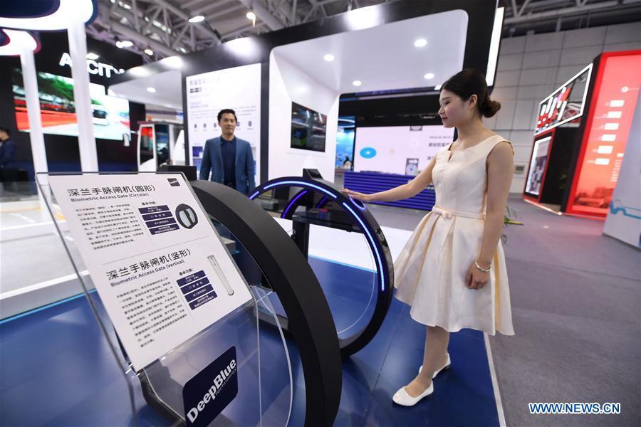 <?php echo strip_tags(addslashes(A staff member shows a biometric access gate made by DeepBlue Technology (Shanghai) Co., Ltd. at the 2nd Digital China Exhibition in Fuzhou, southeast China's Fujian Province, May 5, 2019. The 2nd Digital China Exhibition runs from May 5 to 9 at the Fuzhou Strait International Conference & Exhibition Center. (Xinhua/Lin Shanchuan))) ?>