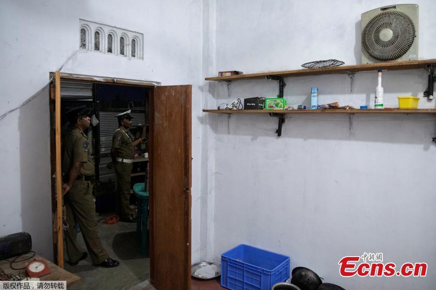 Police officers stand outside a room in a watchtower at a  training camp allegedly linked to Islamist militants, in Kattankudy near Batticaloa, May 5, 2019.