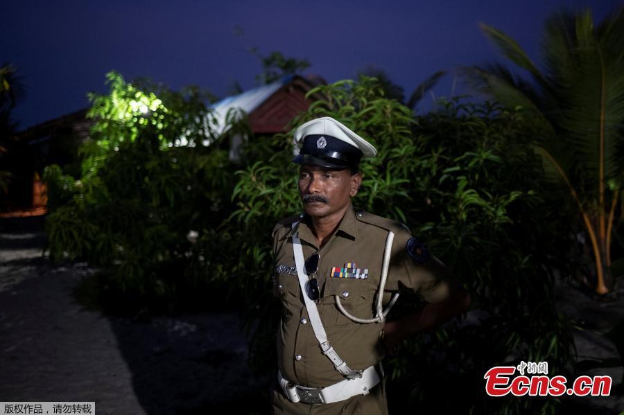 <?php echo strip_tags(addslashes(A police officer stands inside a training camp allegedly linked to Islamist militants, in Kattankudy near Batticaloa, May 5, 2019. (Photo/Agencies))) ?>