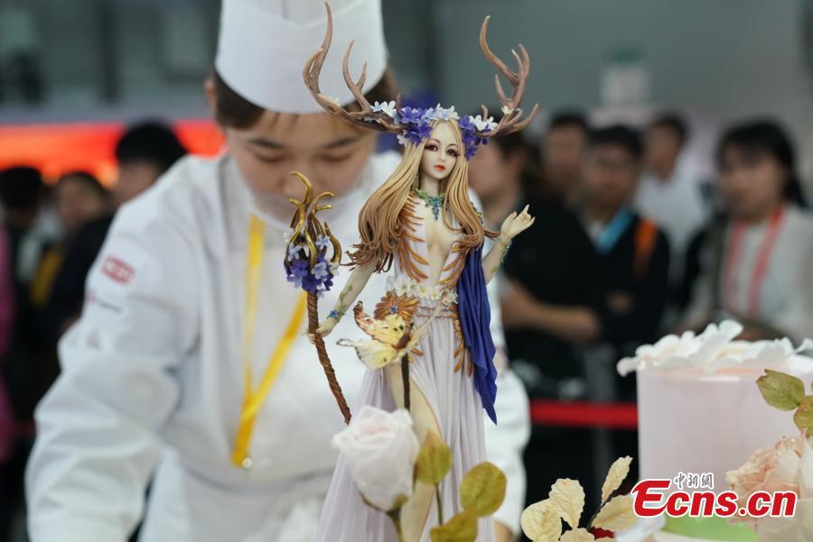 <?php echo strip_tags(addslashes(Participants compete in the 20th National Baking Skills Competition held at the Shanghai New International Expo Center, May 6, 2019. Eighty bakers from across the country took part in the competition organized by the China Association of Bakery and Confectionery Industry as well as other career guidance and industrial agencies. (Photo: China News Service/Wang Xin))) ?>