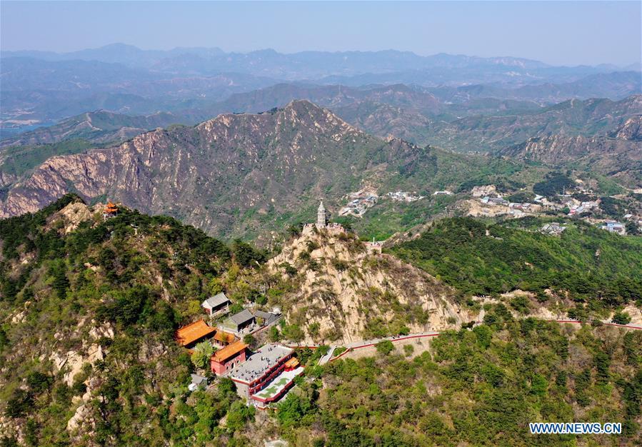 Aerial photo taken on May 2, 2019 shows a tower on the main peak of Panshan Mountain in Jizhou District of Tianjin, north China. May 5 marks the opening of \