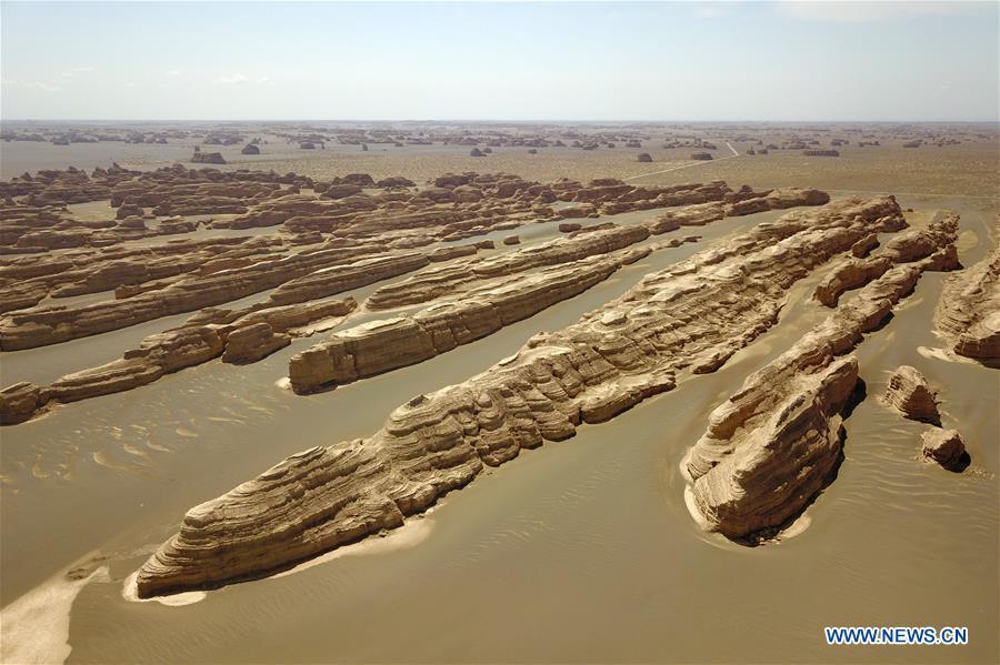 <?php echo strip_tags(addslashes(Aerial photo taken on May 8, 2019 shows the scenery of Dunhuang Yardang National Geopark after a rain in Dunhuang, northwest China's Gansu Province. (Xinhua/Fan Peishen))) ?>