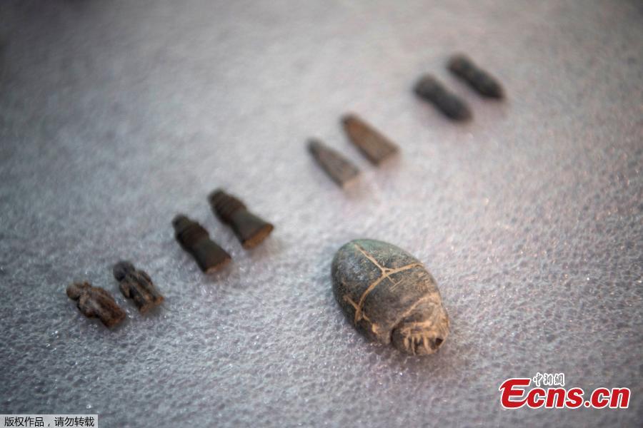 <?php echo strip_tags(addslashes(Small amulets of the mummy Amon Sha-Amun-em-Su are presented to the media by the National Museum during a news conference in Rio de Janeiro, Brazil, Tuesday, May 7, 2019. Brazil's national museum said Tuesday it has recovered 200 pieces from its 700 pieces Egypt collection, the largest in Latin America, after a devastating fire in September 2018. (Photo/Agencies))) ?>