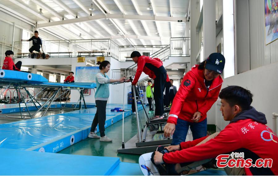 Students train at the Youth Winter Olympic Sports School, or Xuanhua No. 2 Middle School, in Zhangjiakou, Hebei Province, May 9, 2019. The school established in 2015 is the only of its kind to specialize on training of Winter Olympic sports in China. The school has recruited more than 1,200 students, including 200 trained to be competitive skiers. Located some 200km northwest of Beijing, Zhangjiakou will host snowboarding, freestyle skiing, cross-country skiing, ski jumping, Nordic combined and biathlon competitions during the 2022 Winter Games. (Photo: China News Service/Zhai Yujia)