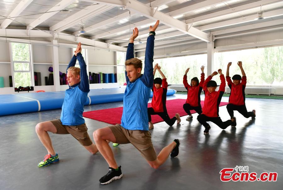 <?php echo strip_tags(addslashes(Coaches from Finland instruct students at the Youth Winter Olympic Sports School, or Xuanhua No. 2 Middle School, in Zhangjiakou, Hebei Province, May 9, 2019. The school established in 2015 is the only of its kind to specialize on training of Winter Olympic sports in China. The school has recruited more than 1,200 students, including 200 trained to be competitive skiers. Located some 200km northwest of Beijing, Zhangjiakou will host snowboarding, freestyle skiing, cross-country skiing, ski jumping, Nordic combined and biathlon competitions during the 2022 Winter Games. (Photo: China News Service/Zhai Yujia))) ?>