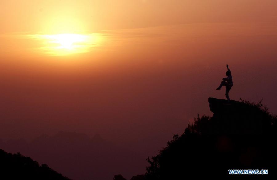 <?php echo strip_tags(addslashes(A Taoist priest practices the Wudang martial arts on a peak of the Wudang Mountain, central China's Hubei Province, May 16, 2006. China will hold the Conference on Dialogue of Asian Civilizations starting from May 15. Under the theme of 