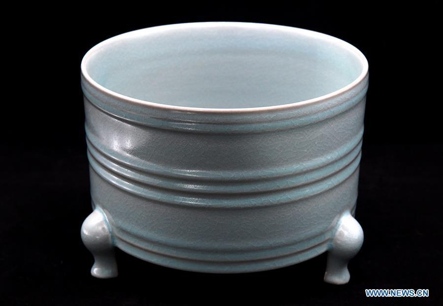 <?php echo strip_tags(addslashes(Photo taken on May 8, 2019 shows a Ru porcelain work made by Wang Junzi in Qingliangsi Village, Baofeng County of central China's Henan Province. Ru porcelain, one of the five famous kinds of porcelains during the Song Dynasty (960-1279) in ancient China, is known for its azure color, light body, filmy grain and gentle textile. Wang Junzi, born in 1960, is a Ru porcelain firing craftsman in Qingliangsi Village of Baofeng County in central China's Henan, where the ancient official Ru porcelain kiln in Song Dynasty is located. In order to reproduce the beauty of 