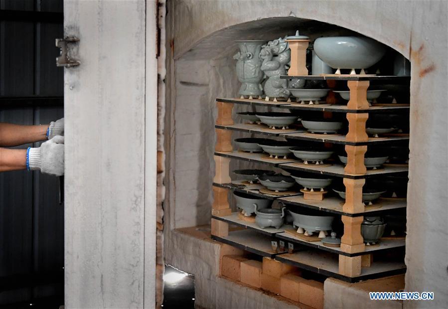 <?php echo strip_tags(addslashes(Wang Junzi opens Ru porcelain kiln at his studio in Qingliangsi Village, Baofeng County of central China's Henan Province, May 9, 2019. Ru porcelain, one of the five famous kinds of porcelains during the Song Dynasty (960-1279) in ancient China, is known for its azure color, light body, filmy grain and gentle textile. Wang Junzi, born in 1960, is a Ru porcelain firing craftsman in Qingliangsi Village of Baofeng County in central China's Henan, where the ancient official Ru porcelain kiln in Song Dynasty is located. In order to reproduce the beauty of 