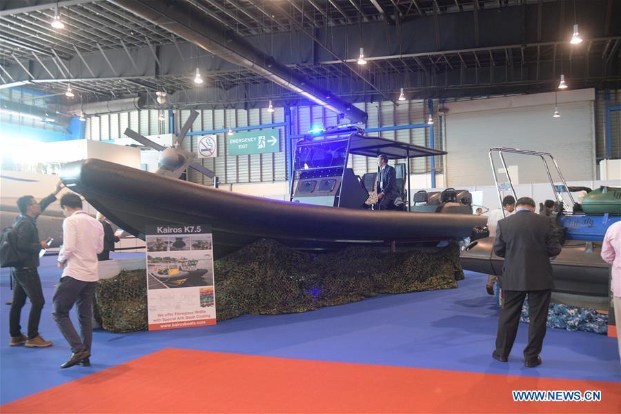 Visitors view exhibits at the 12th International Maritime Defense Exhibition and Conference (IMDEX Asia) in Singapore\'s Changi Exhibition Centre May 14, 2019. Singapore Defense Minister Ng Eng Hen welcomed here Tuesday foreign navies attending the 12th International Maritime Defense Exhibition and Conference (IMDEX Asia) at its opening ceremony. A total of 23 warships from 15 countries sailed their way to IMDEX Asia at the Changi Naval Base, together with 26 chiefs of defense forces and navies, vice chiefs, directors-general of coast guards and senior naval officers. (Xinhua/Then Chih Wey)