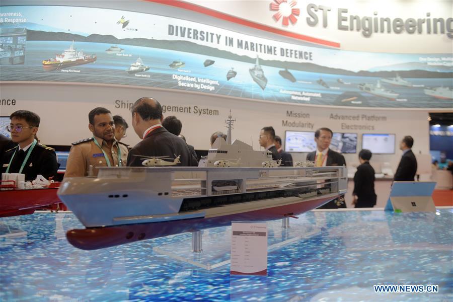 Visitors view exhibits at the 12th International Maritime Defense Exhibition and Conference (IMDEX Asia) in Singapore\'s Changi Exhibition Centre May 14, 2019. Singapore Defense Minister Ng Eng Hen welcomed here Tuesday foreign navies attending the 12th International Maritime Defense Exhibition and Conference (IMDEX Asia) at its opening ceremony. A total of 23 warships from 15 countries sailed their way to IMDEX Asia at the Changi Naval Base, together with 26 chiefs of defense forces and navies, vice chiefs, directors-general of coast guards and senior naval officers. (Xinhua/Then Chih Wey)