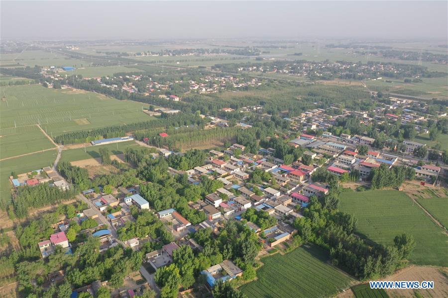 Aerial photo taken on May 14, 2019 shows the view of Gongzhuang Village of Bayu Township, Rongcheng County, Xiongan New Area, north China\'s Hebei Province. Relocation has officially started in Xiongan New Area, a new city in the making about 100 kilometers southwest of Beijing. A large-scale building phase will start this year at Xiongan, authorities said. A 13-sq-km residential area will be built in the east part of Rongcheng County. (Xinhua/Zhu Xudong)